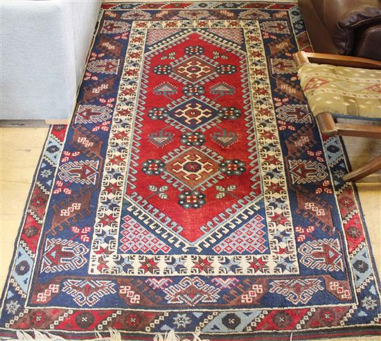 Woollen red ground Persian rug